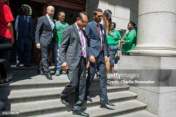 Anni Dewani's father Mr Vinod Hindocha and son Anish Hindocha leave the the Western Cape High Court for a lunch break during the trial of Shrien...