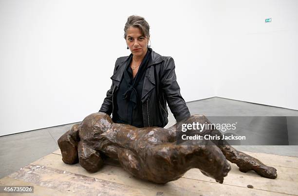 Artist Tracey Emin poses in front of her work as part of her 'The Last Great Adventure is You' Exhibition at the White Cube Gallery on October 6,...