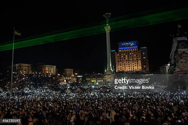 Thousands of mobile phone flashlights light up the Maidan Square as rock band Okean Elzy perform live on stage on December 14, 2013 in Kiev, Ukraine....