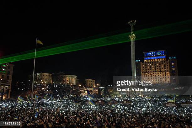 Thousands of mobile phone flashlights light up the Maidan Square as rock band Okean Elzy perform live on stage on December 14, 2013 in Kiev, Ukraine....