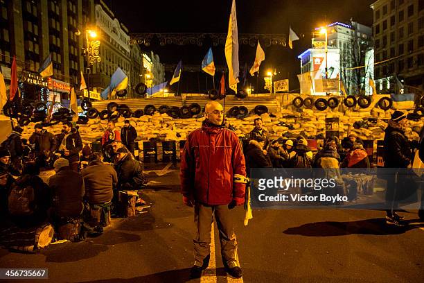 Protester guards the makeshift barricade near Khreshchatyk street on Maidan Square on December 14, 2013 in Kiev, Ukraine. Anti-government protests...