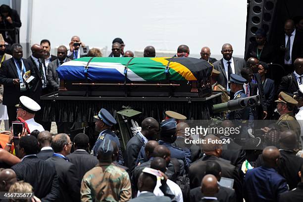 The funeral procession leaving for the grave site following Madiba's State Funeral on December 15, 2013 in Qunu, South Africa. Nelson Mandela passed...