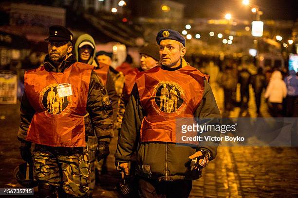 Protesters in military uniform patrol Maidan Square on December 14, 2013 in Kiev, Ukraine. Anti-government protests began three weeks ago when...