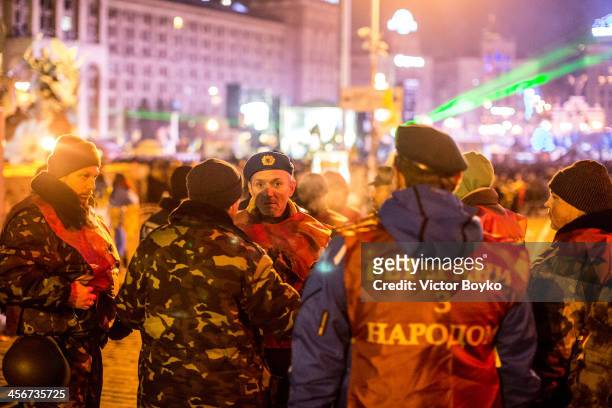Protesters in military uniform patrol Maidan Square on December 14, 2013 in Kiev, Ukraine. Anti-government protests began three weeks ago when...