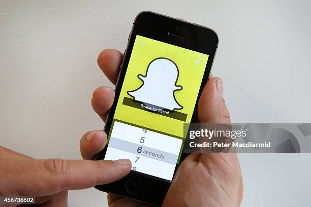 In this photo illustration the Snapchat app is used on an iPhone on October 6, 2014 in London, England. Snapchat allows users' messages to vanish...