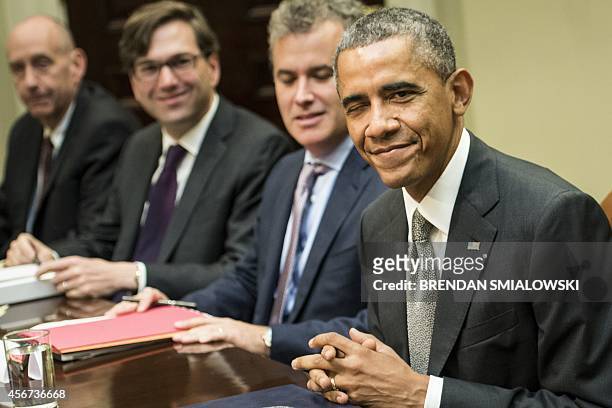 Neil Eggleston, White House Counsel, Jason Furman, Chairman of the Council of Economic Advisers, Jeff Zients, Director of the National Economic...