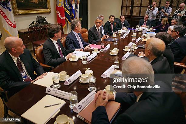 President Barack Obama meets with federal financial regulators, including White House Counsel Neil Eggleston, Council of Economic Advisors Chairman...