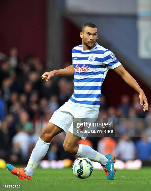 Queens Park Rangers' English defender Steven Caulker controls the ball during the English Premier League football match against West Ham United at...