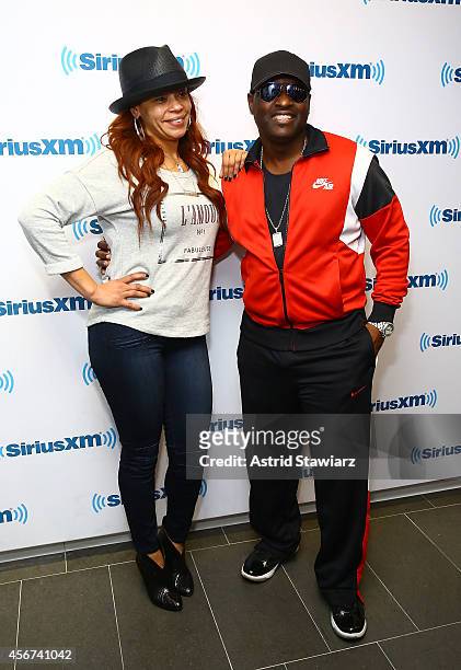 Singers Faith Evans and Johnny Gill visit the SiriusXM Studios on October 6, 2014 in New York City.