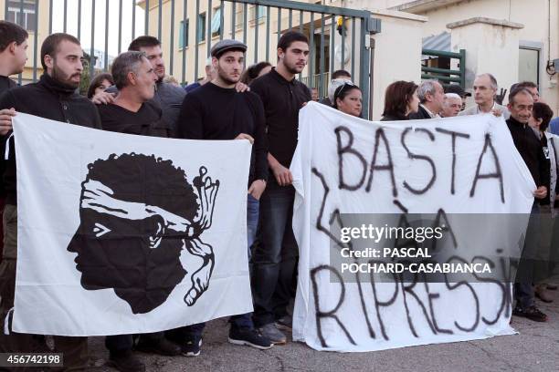 Around fifty people gather with Corsican nationalist flags in front of Aspretto gendarmerie to show support to two lawyers and a dozen other persons...
