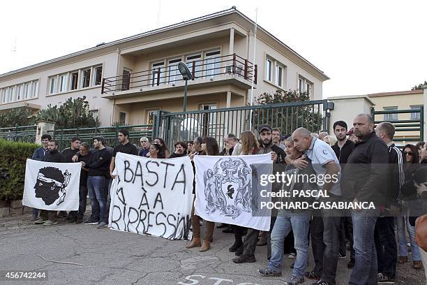 Around fifty people gather with Corsican nationalist flags in front of Aspretto gendarmerie to show support to two lawyers and a dozen other persons...