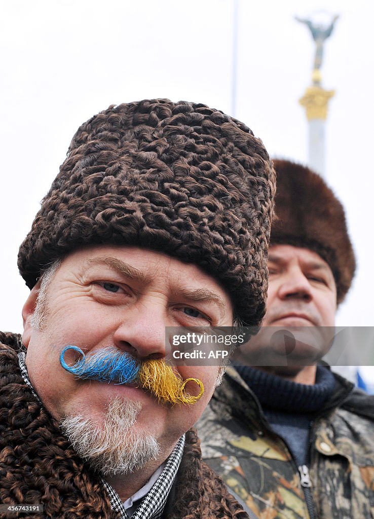 Mascal Ukraine A man with a mustache painted in the colors of the Ukrainian flag ...