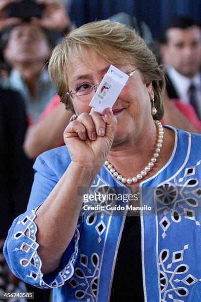 Presidential candidate Michelle Bachelet votes during the Presidential Ballotage in Chile between her and Evelyn Mattehi on December 15, 2013 in...