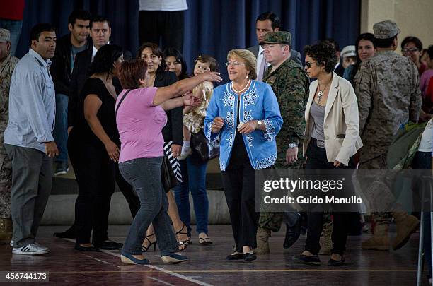 Socialist candidate Michelle Bachelet votes during the presidential ballotage in Chile between her and evelyn Matthei on December 15, 2013 in...