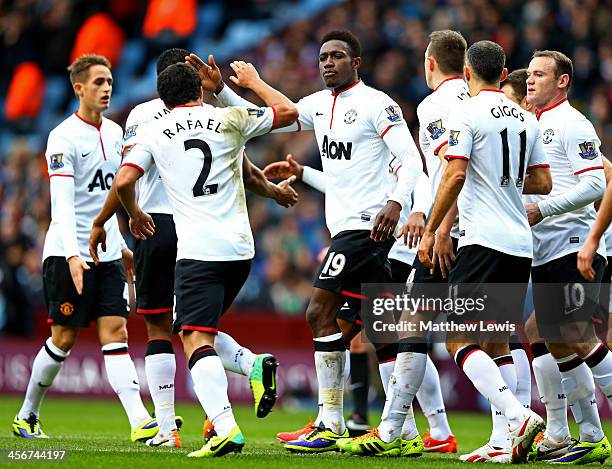 Danny Welbeck of Manchester United is by congratulated by Rafael da Silva and team mates as he scores their first goal during the Barclays Premier...