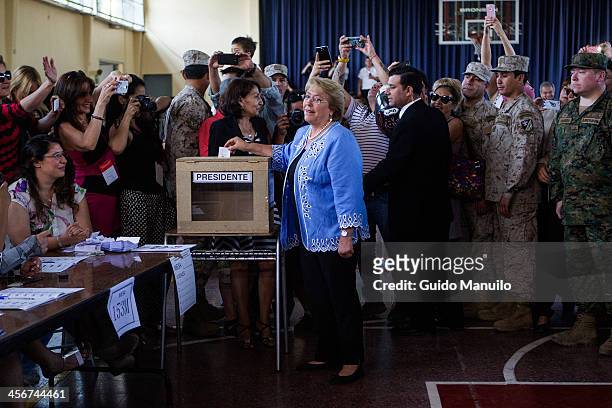 Socialist candidate Michelle Bachelet votes during the presidential ballotage in Chile between her and evelyn Matthei at Enrique Teresiano de Ossó...