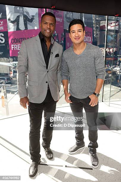 Mario Lopez and AJ Calloway host "Extra" at their New York studios at H&M in Times Square on October 6, 2014 in New York City.