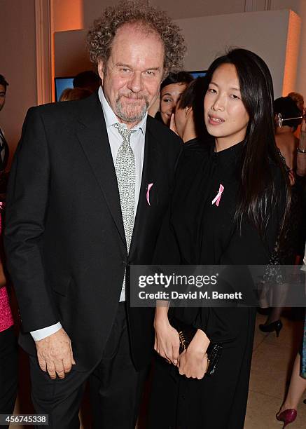 Mike Figgis and Rosey Chan attend the launch of The Estee Lauder Companies' UK Breast Cancer Awareness Campaign 2014 "Hear Our Stories. Share Yours"...