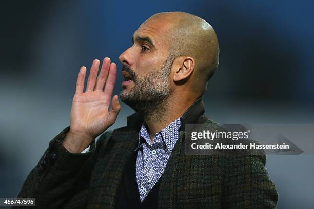Josep Guardiola, head coach of Muenchen reacts during the Finale of the Paulaner Cup 2014 between FC Bayern Muenchen and Paulaner Traumelf at...