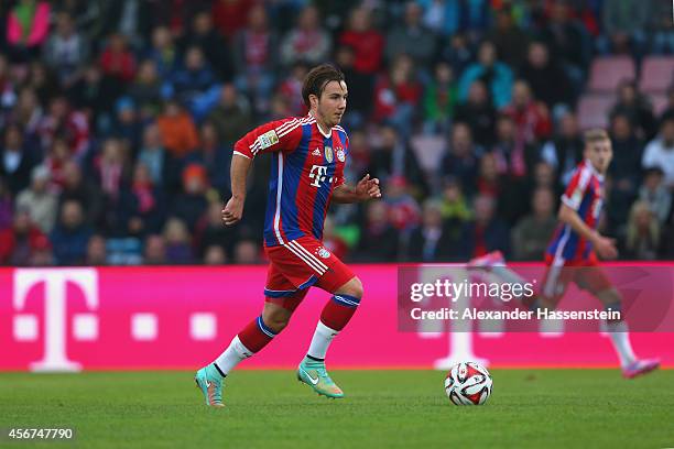 Mario Goetze of Muenchen runs with the ball during the Finale of the Paulaner Cup 2014 between FC Bayern Muenchen and Paulaner Traumelf at Alpenbauer...