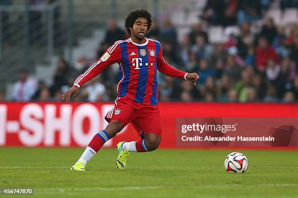 Dante of Muenchen runs with the ball during the Finale of the Paulaner Cup 2014 between FC Bayern Muenchen and Paulaner Traumelf at Alpenbauer...