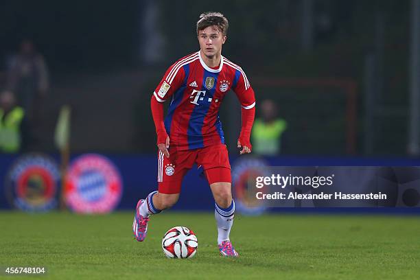 Yannick Guenzel of Muenchen runs with the ball during the Finale of the Paulaner Cup 2014 between FC Bayern Muenchen and Paulaner Traumelf at...