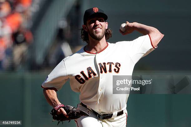 Madison Bumgarner of the San Francisco Giants pitches in the first inning against the Washington Nationals during Game Three of the National League...