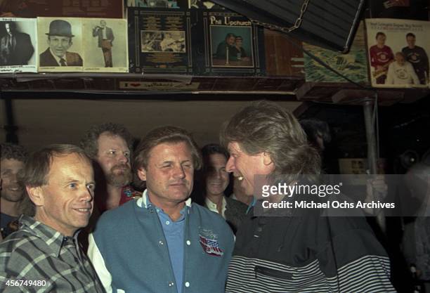 Pianist Don Randi poses for a portrait with Al Jardine and Bruce Johnston of the rock and roll band "The Beach Boys" at a Hal Blaine book release...