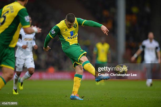 Gary Hooper of Norwich scores their fisrt goal during the Barclays Premier League match between Norwich City and Swansea City at Carrow Road on...