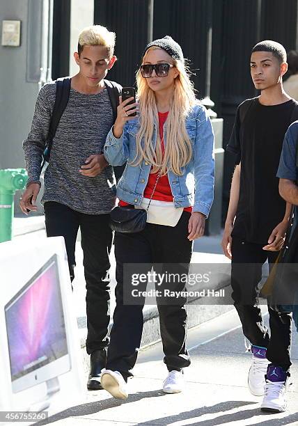 Actress Amanda Bynes is seen taking photos with funs outside the apple store and doing her make up on the street in Soho on October 6, 2014 in New...