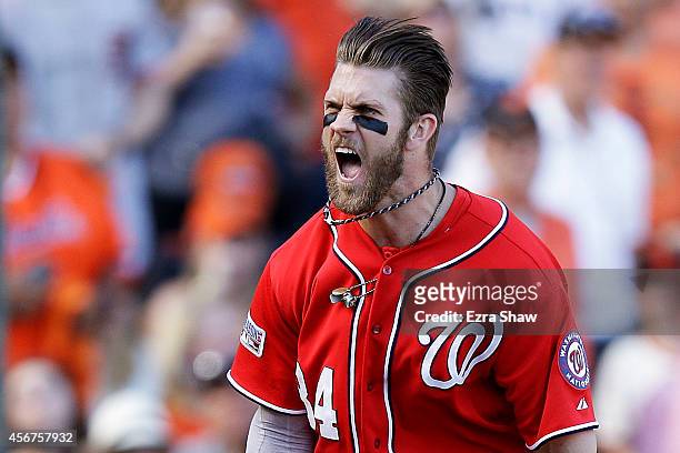 Bryce Harper of the Washington Nationals celebrates after scoring on a throwing error by Madison Bumgarner of the San Francisco Giants in the seventh...