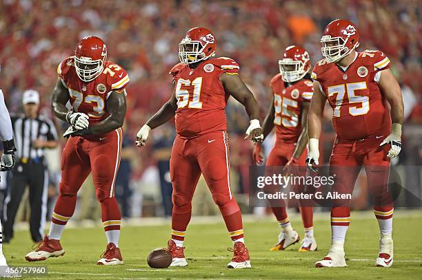 Offensive linemen Rodney Hudson, Mike McGlynn, Zach Fulton and of the Kansas City Chiefs get set against the New England Patriots during the first...