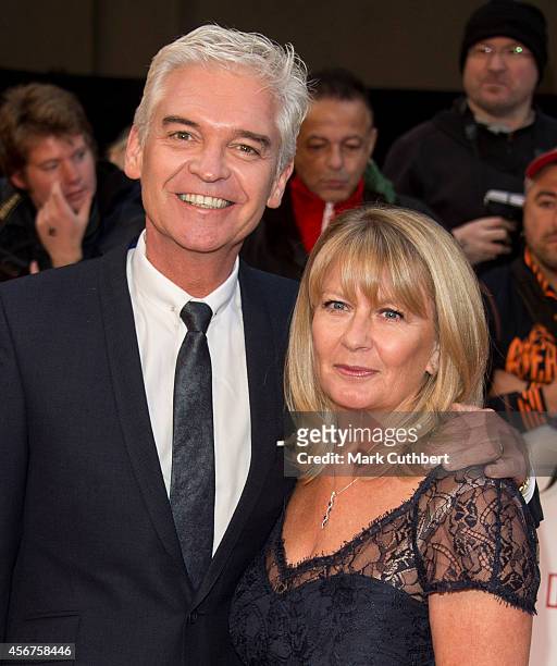 Phillip Schofield and Stephanie Lowe attend the Pride of Britain awards at The Grosvenor House Hotel on October 6, 2014 in London, England.