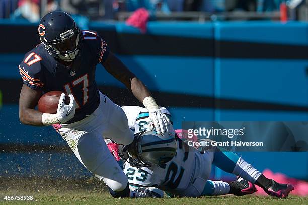 Melvin White of the Carolina Panthers tackles Alshon Jeffery of the Chicago Bears during their game at Bank of America Stadium on October 5, 2014 in...