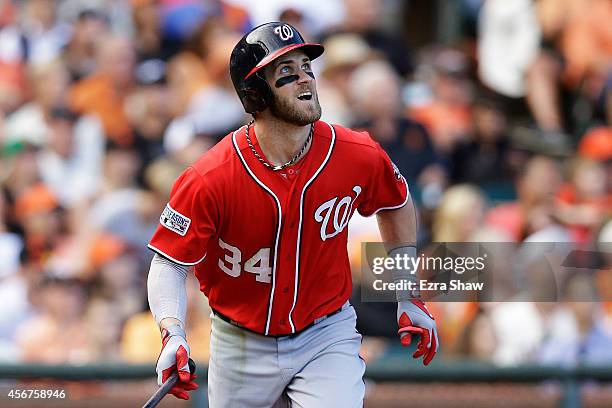 Bryce Harper of the Washington Nationals watches his solo home run in the ninth inning against the San Francisco Giants during Game Three of the...