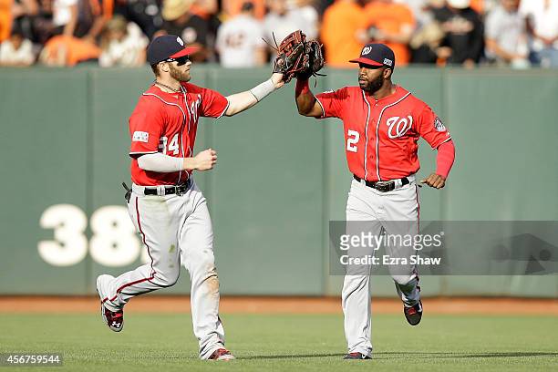 Bryce Harper celebrates with Denard Span of the Washington Nationals after their 4 to 1 win over the San Francisco Giants during Game Three of the...