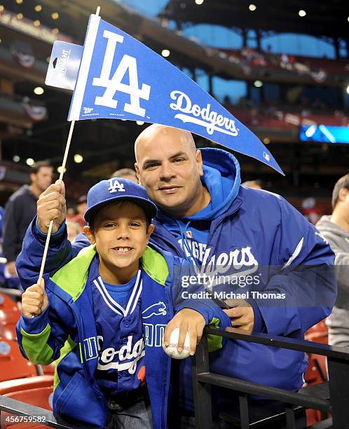 Los Angeles Dodgers fans pose before the start of Game Three of the National League Division Series against the St. Louis Cardinals at Busch Stadium...