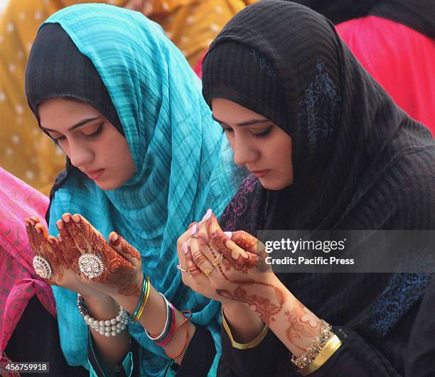 Pakistani Muslim women devotees take part in the Congregational prayers of Eid al-Adha in Lahore. Muslims around the world celebrate the Eid al-Adha...