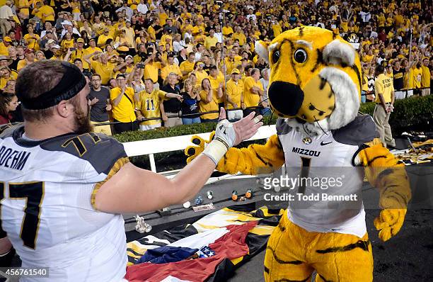 Offensive lineman Evan Boehm of the Missouri Tigers celebrates with mascot Truman after the game against the South Carolina Gamecocks on September...