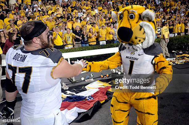 Offensive lineman Evan Boehm of the Missouri Tigers celebrates with mascot Truman after the game against the South Carolina Gamecocks on September...