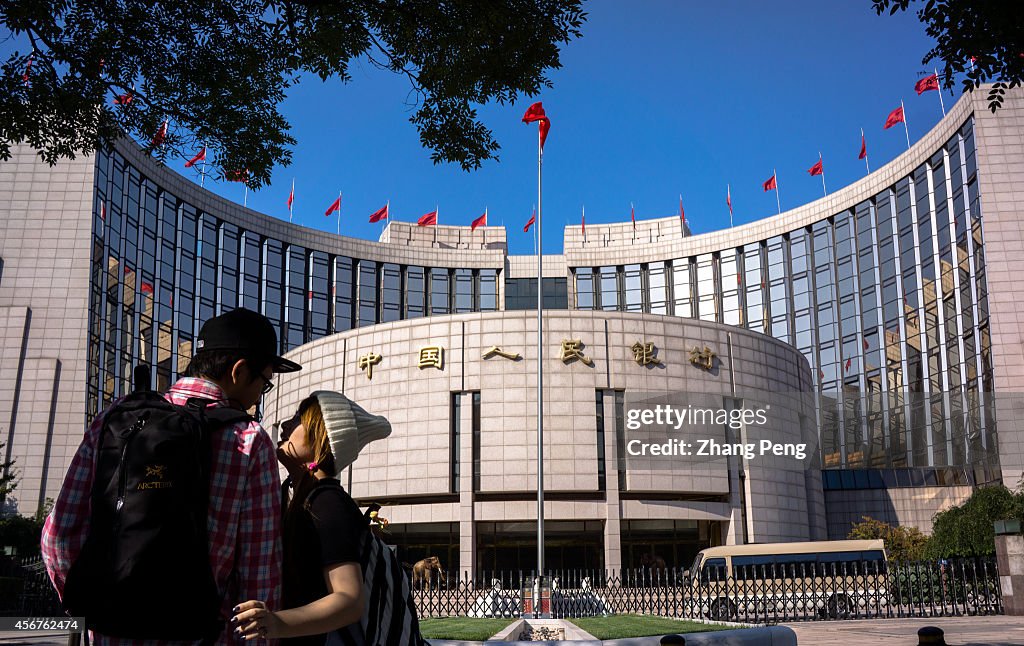 A couple of young lovers in front of the People's Bank of...
