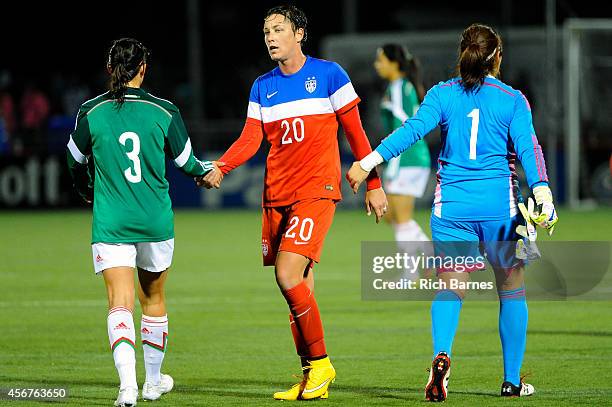 Abby Wambach of the United States greets Monica Alvarado and Cecilia Santiago of Mexico following the match at Sahlen's Stadium on September 18, 2014...