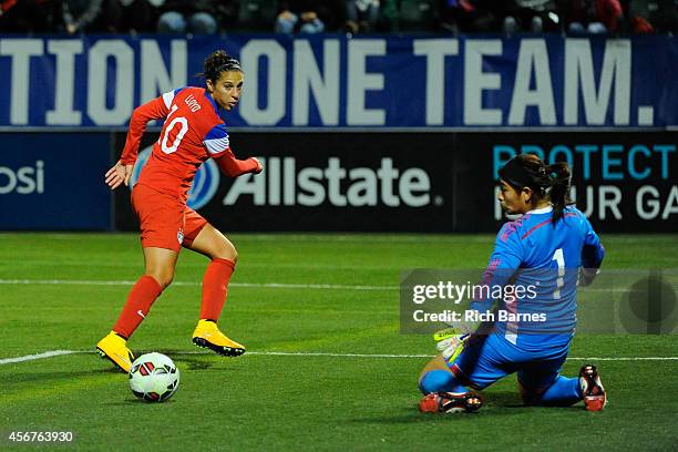 Carli Lloyd of the United States takes a shot on Cecilia Santiago of Mexico during the first half of the match at Sahlen's Stadium on September 18,...