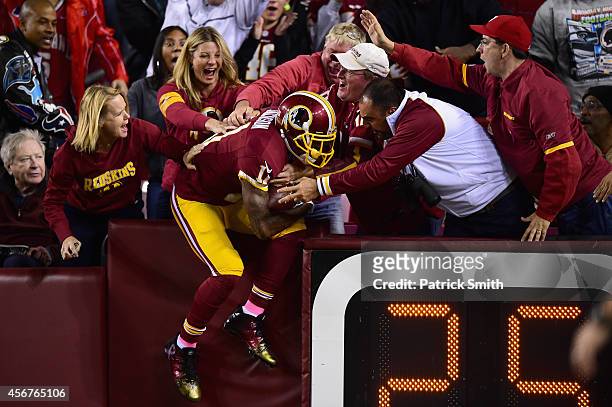 Wide receiver DeSean Jackson of the Washington Redskins celebrates with fans following his second quarter touchdown against the Seattle Seahawks at...