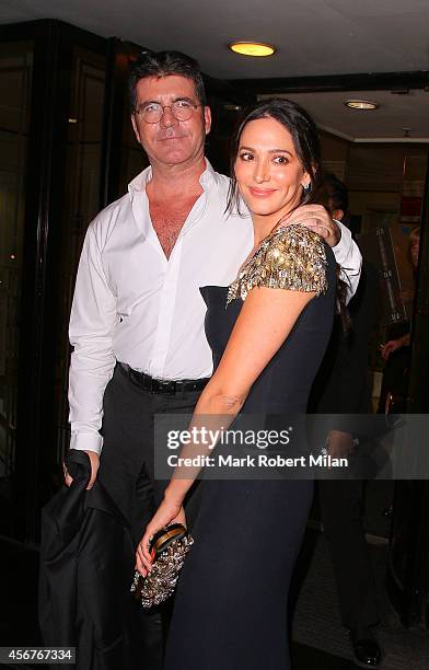 Lauren Silverman and Simon Cowell attend the Pride of Britain awards at The Grosvenor House Hotel on October 6, 2014 in London, England.