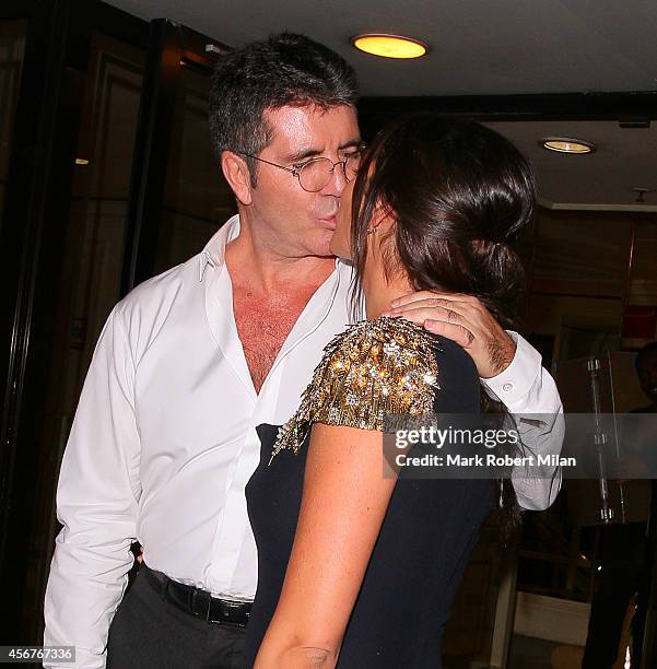 Lauren Silverman and Simon Cowell attend the Pride of Britain awards at The Grosvenor House Hotel on October 6, 2014 in London, England.