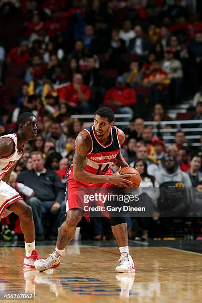 Glen Rice Jr. #14 of the Washington Wizards handles the ball against the Chicago Bulls on October 6, 2014 at the United Center in Chicago, Illinois....