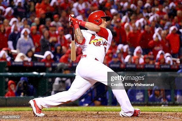 Kolten Wong of the St. Louis Cardinals hits a two-run home run in the seventh inning against the Los Angeles Dodgers in Game Three of the National...