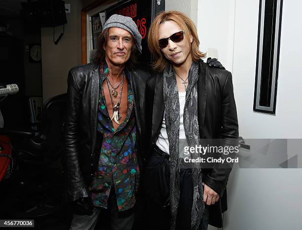 Musicians Joe Perry and Yoshiki visit the SiriusXM Studios on October 6, 2014 in New York City.