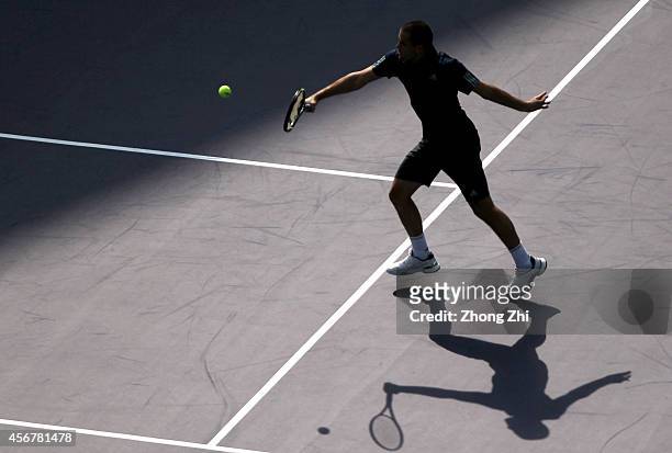 Mikhail Youzhny of Russia returns a shot during his match against Ernests Gulbis of Latvia during the day 3 of the Shanghai Rolex Masters at the Qi...